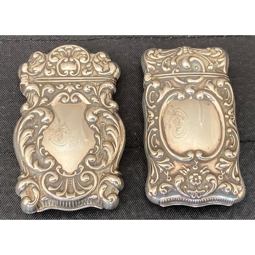 863 - Two silver vesta cases with 'Sterling' stamped to inner opening. 6.5cm h. Total 42gm.