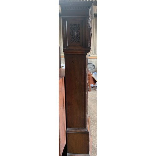 1034A - A Maple of London carved oak longcase clock, with three train movement and Westminster chime. 162 h ... 