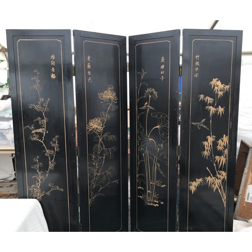 15 - A large coromandel room dividing screen depicting oriental scenes. 183 h, four panels each 46cm w.