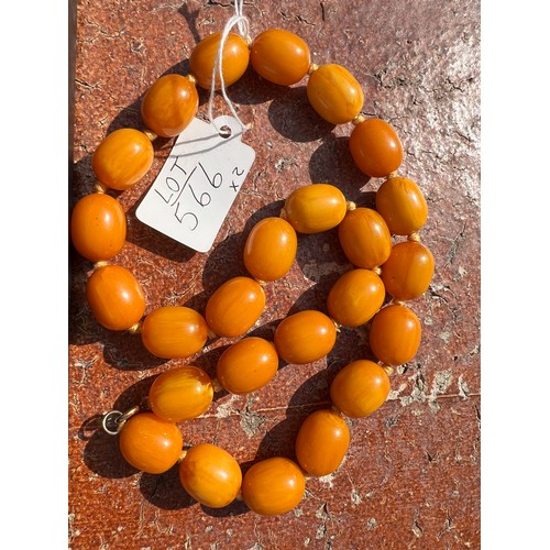 566 - Two string of butterscotch amber beads, approx length 80 & 52cm. 213.9gm.