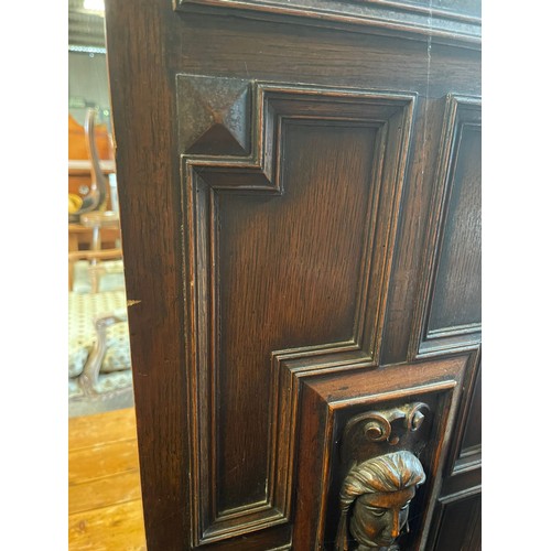 1034A - A Maple of London carved oak longcase clock, with three train movement and Westminster chime. 162 h ... 