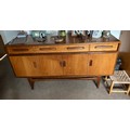 A G-Plan teak sideboard with 4 drawers and 4 doors. 150cm w x 46 d x 85cm h.