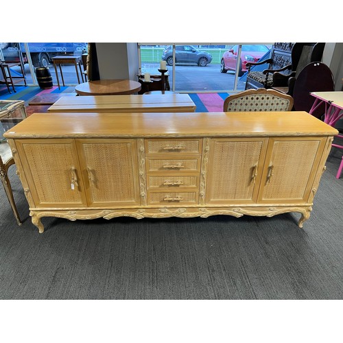 103 - Large Italian wooden cane and glass topped dining table, 2 sideboard corner cabinet and 10 chairs wi... 