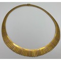 An 18ct gold collar style necklace in tri colour gold. Weight 47gm.