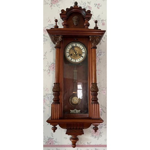 1183 - A 19thC walnut Vienna wall clock. 99 x 33cm w.