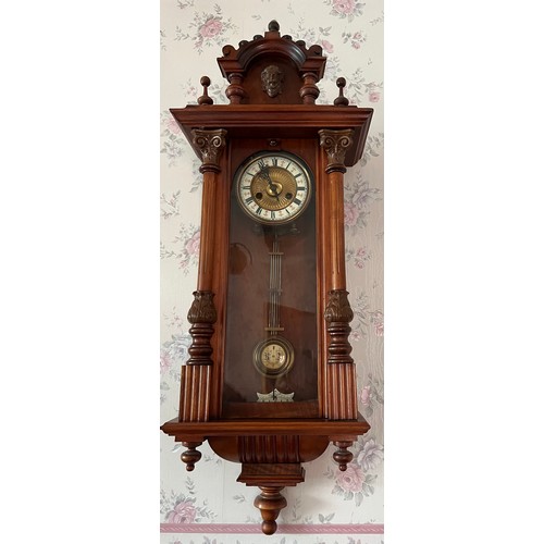 1183 - A 19thC walnut Vienna wall clock. 99 x 33cm w.