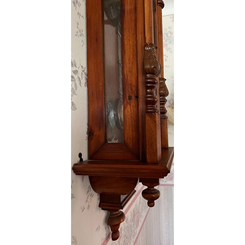 1183 - A 19thC walnut Vienna wall clock. 99 x 33cm w.