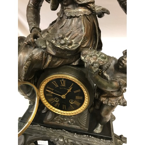 1184 - Large bronze and black marble ornate French mantle clock, depicting a seated classical female figure... 