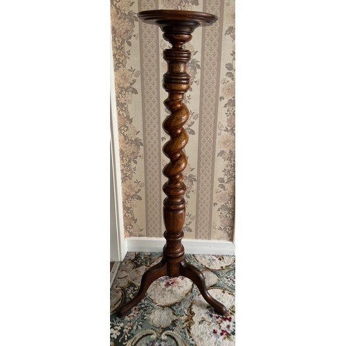 69 - A 19thC mahogany torchere with twisted stem. 113 cm h.