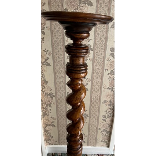 69 - A 19thC mahogany torchere with twisted stem. 113 cm h.