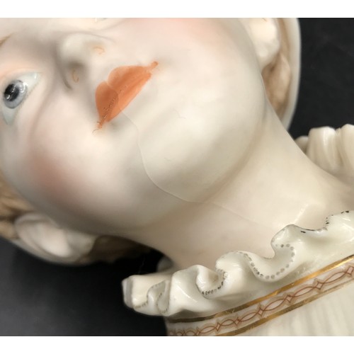 294 - KPM 19thC porcelain bust of a young girl on an octagonal base 25cm together with a tall bisque figur... 