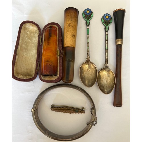 528 - A miscellany to include silver bangle, Edwardian brooch, cheroot, cigarette holders, amber cheroot h... 