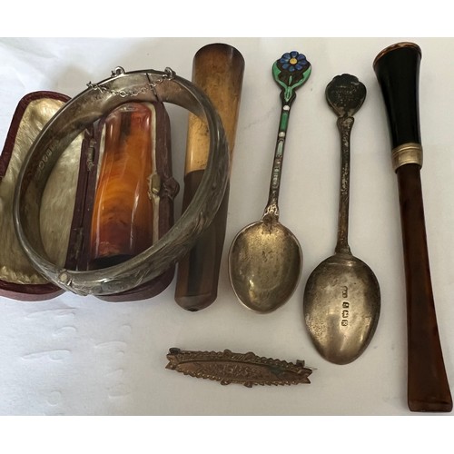 528 - A miscellany to include silver bangle, Edwardian brooch, cheroot, cigarette holders, amber cheroot h... 