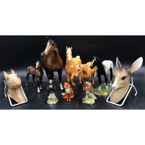 280 - A collection of ceramic animals to include a Royal Doulton black horse, W.R. Midwinter deer faun wal... 