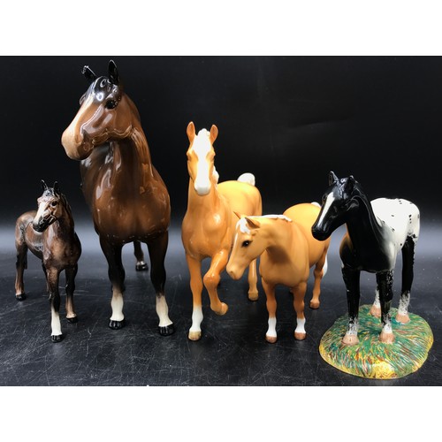 280 - A collection of ceramic animals to include a Royal Doulton black horse, W.R. Midwinter deer faun wal... 