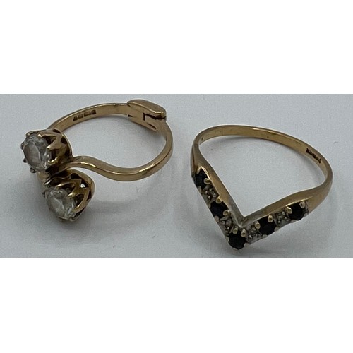 535 - Two 9ct gold dress rings. One hinged the other wishbone shaped. Size D and L, total weight 4.1gm.