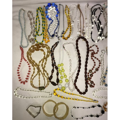 544 - A quantity of good quality vintage glass bead necklaces, bangles and bracelet.