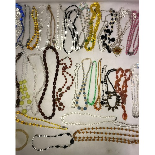 544 - A quantity of good quality vintage glass bead necklaces, bangles and bracelet.