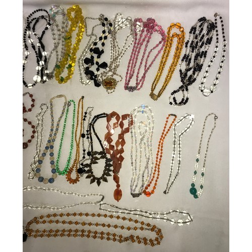 544 - A quantity of good quality vintage glass bead necklaces, bangles and bracelet.