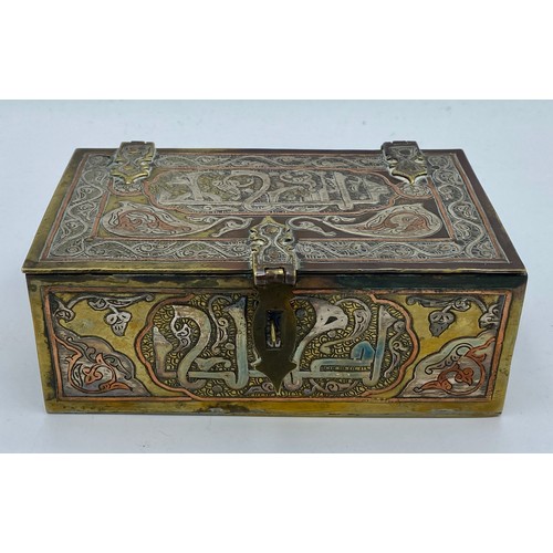 945 - A good quality Cairo Ware silver, copper and brass inlaid rectangular casket with script and foliate... 