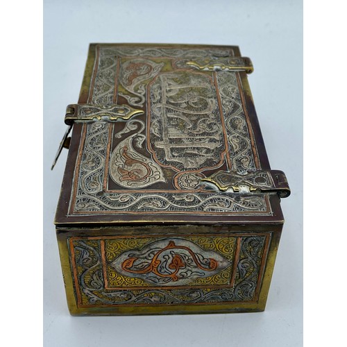 945 - A good quality Cairo Ware silver, copper and brass inlaid rectangular casket with script and foliate... 