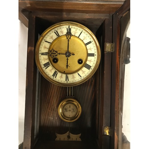 1187 - A wall clock with R A marked on pendulum with key. Approx. 60 h x 16 d x 30cm w.