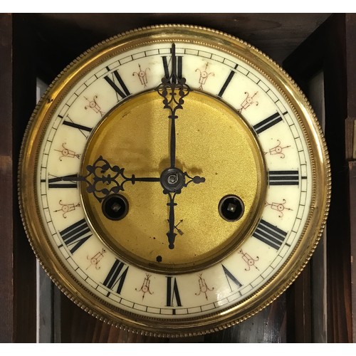 1187 - A wall clock with R A marked on pendulum with key. Approx. 60 h x 16 d x 30cm w.