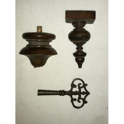 1187 - A wall clock with R A marked on pendulum with key. Approx. 60 h x 16 d x 30cm w.