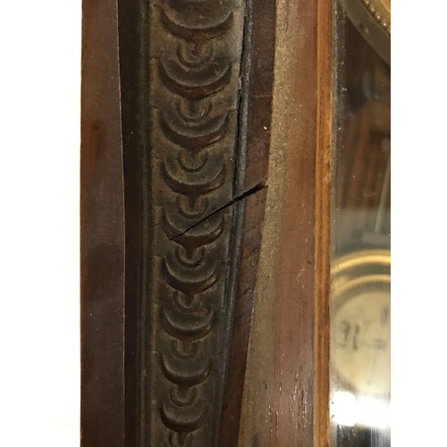 1187 - A wall clock with R A marked on pendulum with key. Approx. 60 h x 16 d x 30cm w.