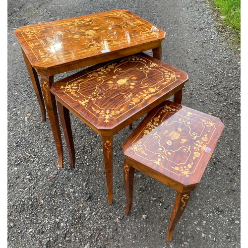 70 - Nest of three lacquered inlaid occasional tables made in Italy, the smallest has a lifting lid with ... 