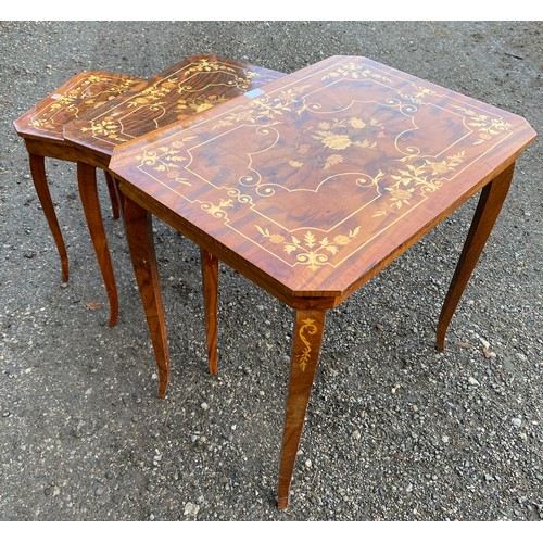 70 - Nest of three lacquered inlaid occasional tables made in Italy, the smallest has a lifting lid with ... 