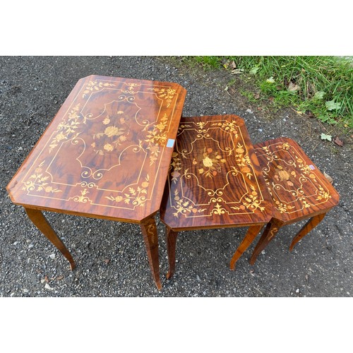 70 - Nest of three lacquered inlaid occasional tables made in Italy, the smallest has a lifting lid with ... 