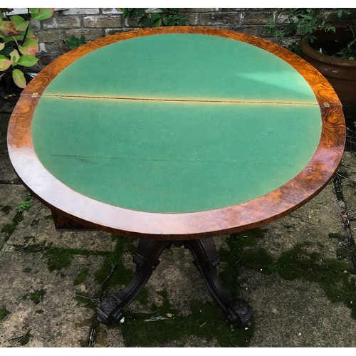 71 - A Victorian walnut demilune card table, hinged top enclosing a baize lined playing surface, turned c... 