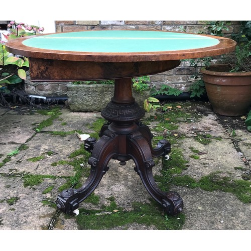 71 - A Victorian walnut demilune card table, hinged top enclosing a baize lined playing surface, turned c... 