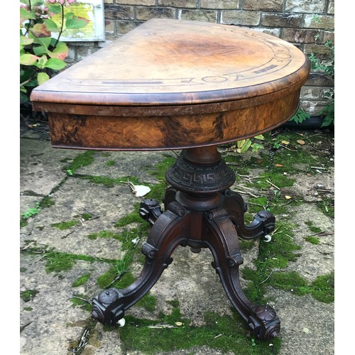 71 - A Victorian walnut demilune card table, hinged top enclosing a baize lined playing surface, turned c... 