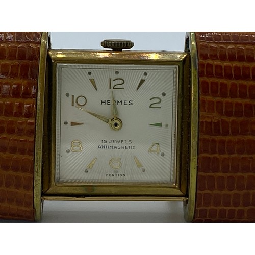 1180 - Hermes 15 jewels Antimagnetic leather bound travel clock. US PAT 2640668. US PAT 2719402.