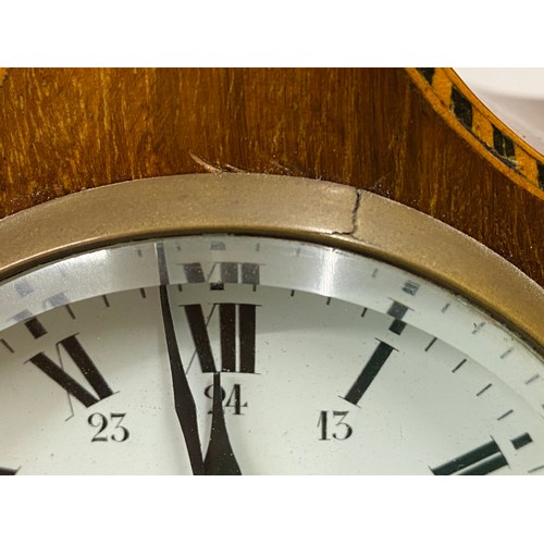 1181 - An Edwardian mahogany inlaid mantel clock with brass feet, finial and key.