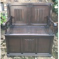 Dark wood Monks Bench with top that tips to make back rest and a seat that lifts up for storage. 105... 