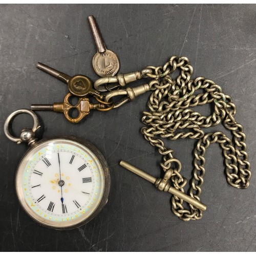 969 - A continental silver pocket watch marked .935 along with a white metal chain with three keys attache... 