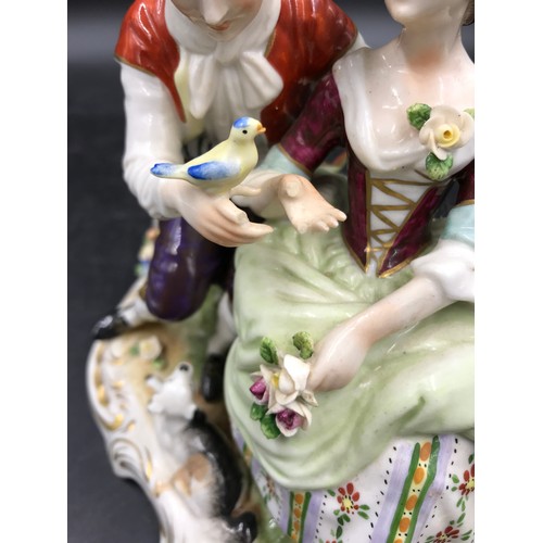 302 - A collection of four ceramic models to include three couples with markings on the base and one royal... 