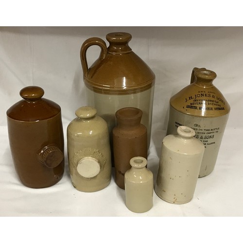 304 - Collection of stoneware receptacles to include large flagon 35cm h, smaller flagon 26cm h with J H J... 