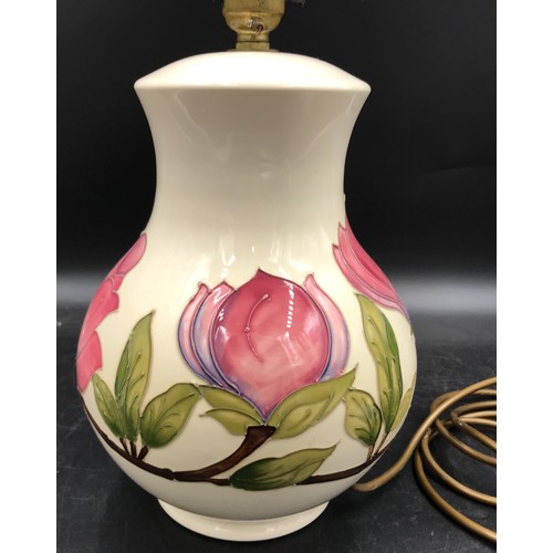 308 - A Moorcroft pottery table lamp decorated with Magnolia design on a cream background, 32 cm h to top ... 