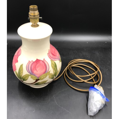 308 - A Moorcroft pottery table lamp decorated with Magnolia design on a cream background, 32 cm h to top ... 