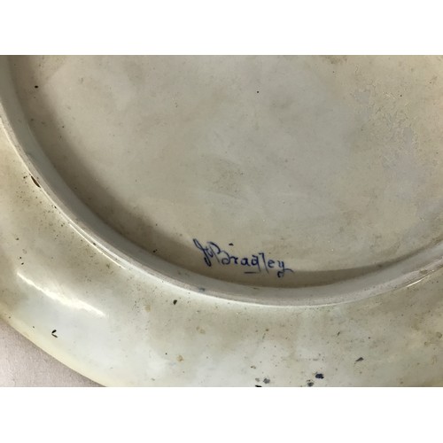 314 - Ceramics to include very large charger signed J C Bradley to back, Carton Ware bowl decorated with o... 