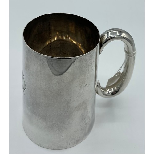 747 - A silver tankard Sheffield 1943, maker James Dixon & Sons Ltd. 342g. 13cm h. Initialled to the front... 