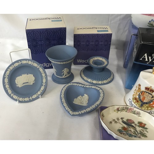 322 - A collection of mixed ceramics to include five Wedgewood pieces posy pot, fluted candlestick, silver... 