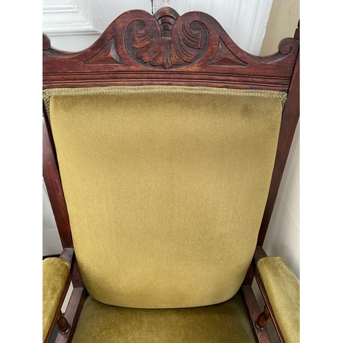 80 - A pair of Edwardian stained beech upholstered armchairs on casters 107 h to back to chair 42cm h to ... 