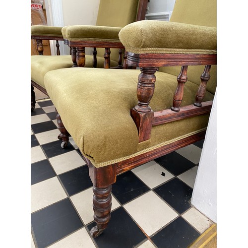 80 - A pair of Edwardian stained beech upholstered armchairs on casters 107 h to back to chair 42cm h to ... 