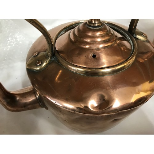 1051 - Two Victorian copper kettles and a silver plated spirit kettle. Copper kettles measuring at 29 h 28c... 