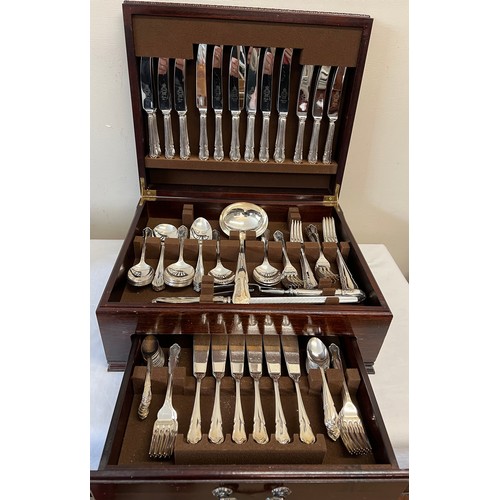 695 - A a wooden cased canteen of silver plated cutlery with drawer to front.